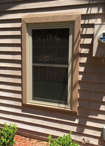 A window with blinds on the outside of it.
