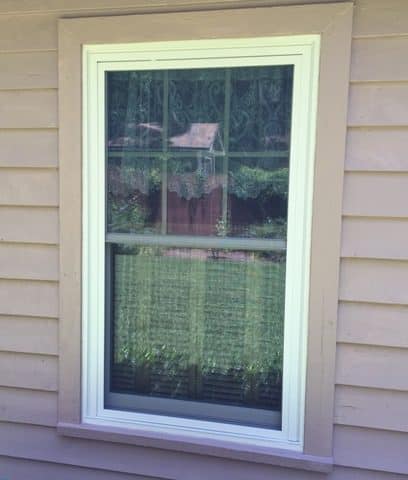 A window with a screen in the middle of it