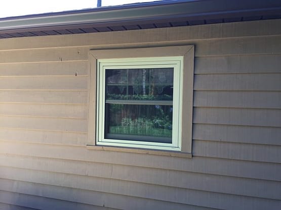 A window in the side of a house.