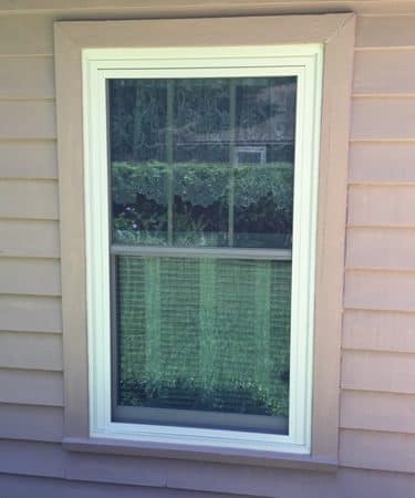A window with a green screen in the middle of it.