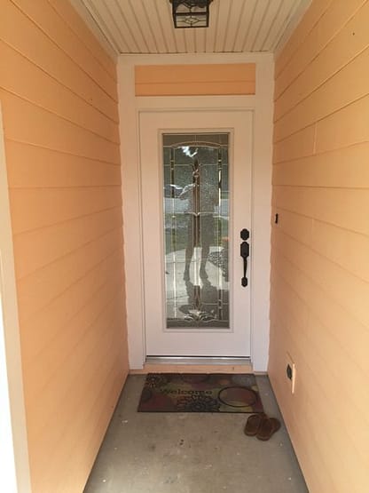 A door with glass in the middle of it