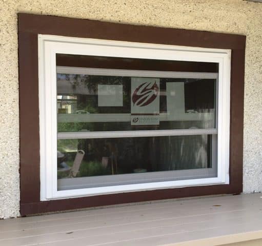 A window with a picture of a building on it.