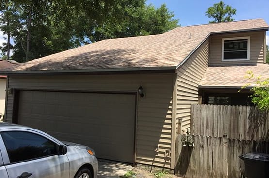 A car parked in front of a house.