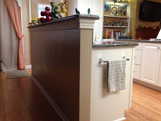 A kitchen with a counter and cabinets in it