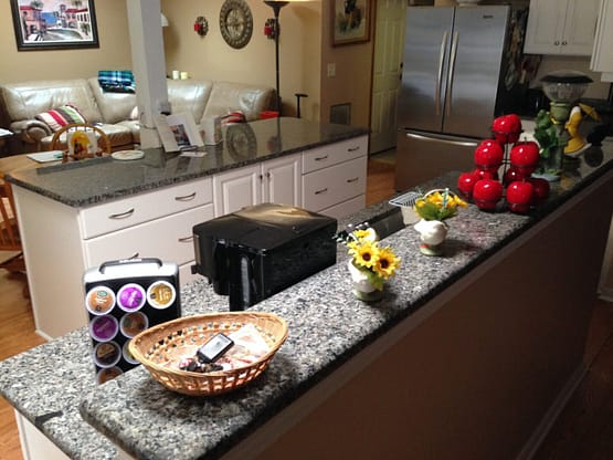 A kitchen counter with bowls and plates on it.