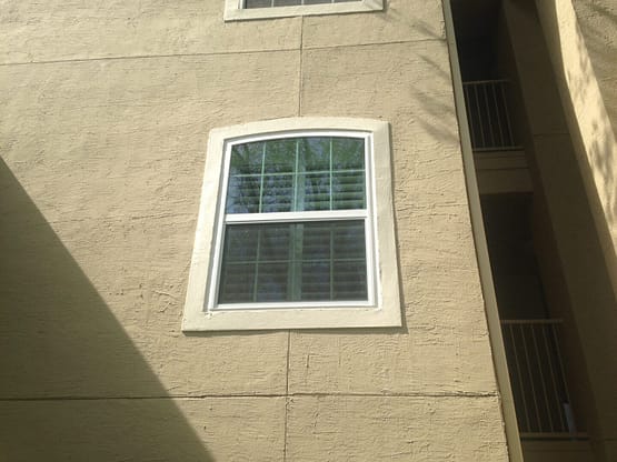 A window in the corner of a building.