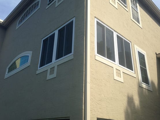 A building with many windows and some signs on it