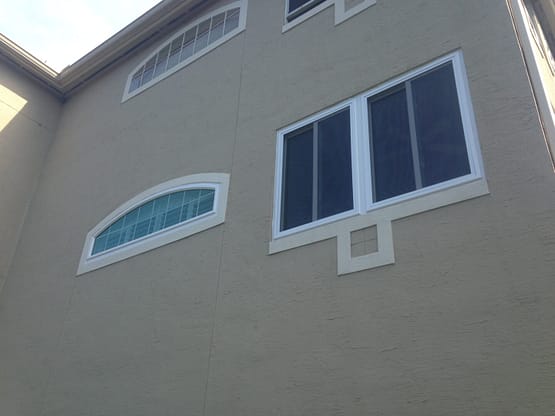 A building with two windows and one door.