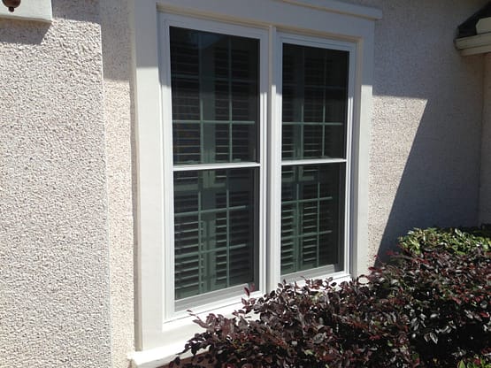 A window with two windows and one is closed.