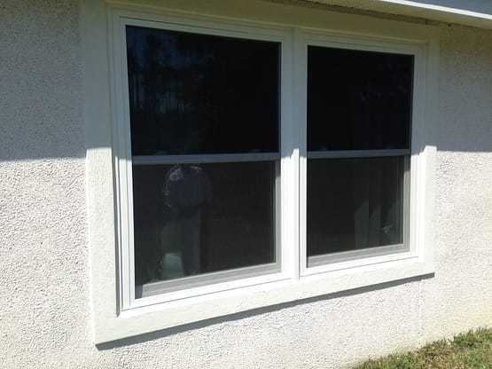 A window with two windows in the middle of it.