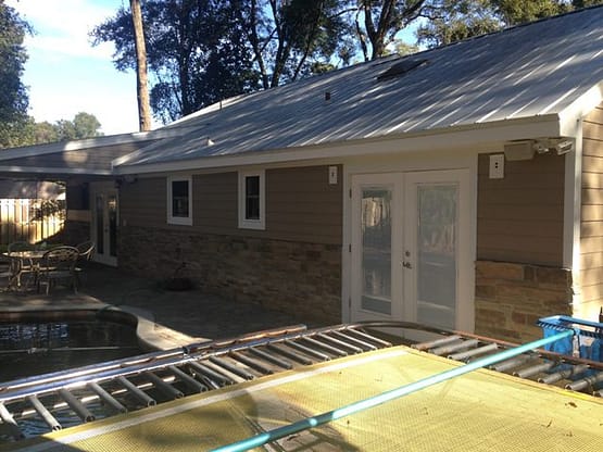 A house that is being remodeled with the help of a team.