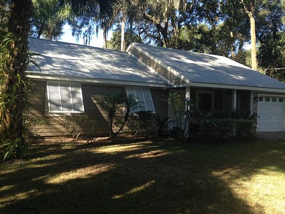 A large white tent in the middle of a field.