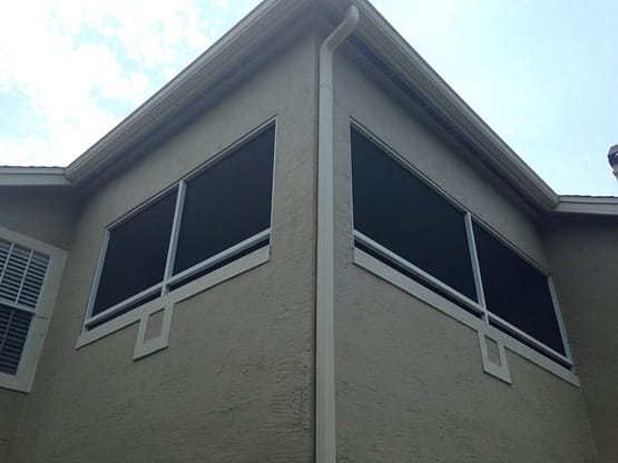 A building with two windows and a roof.