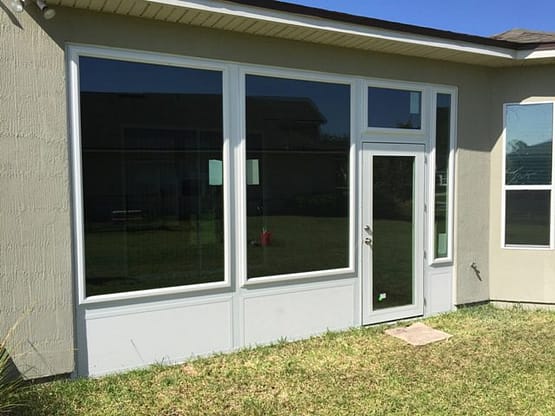A house with two windows and a door.
