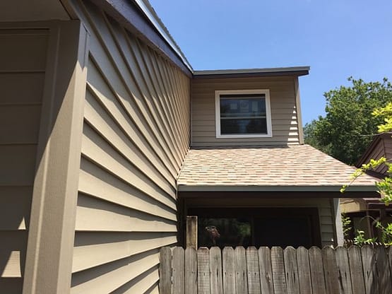 A house with a fence and a window.