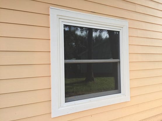 A window that is on the side of a house.