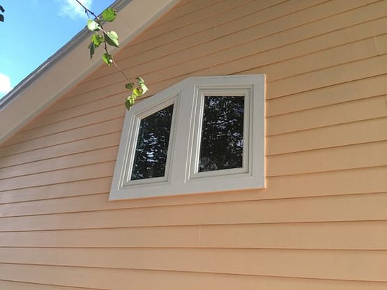A window on the side of a house.