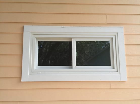 A window on the side of a house.