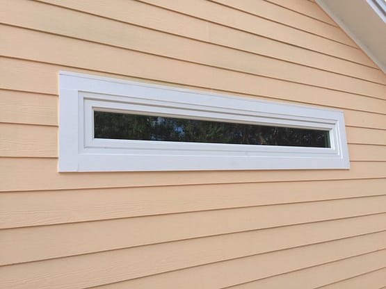 A window on the side of a house.