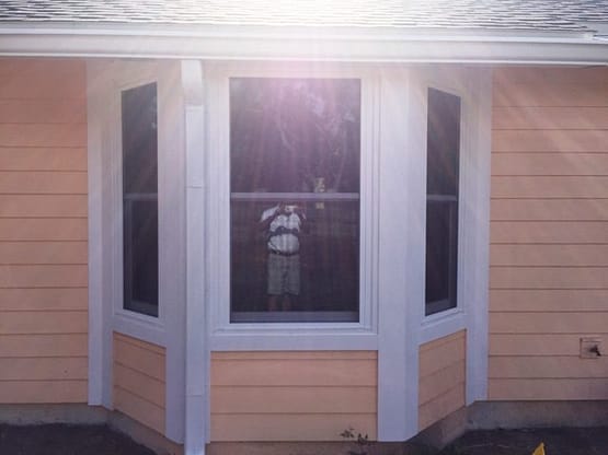 A window with the sun shining through.