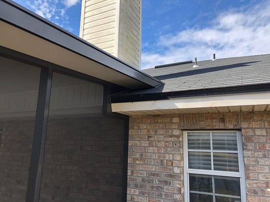 A building with a large window and a chimney.