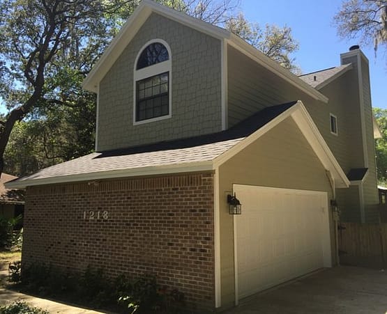 A garage with a large window and a door.
