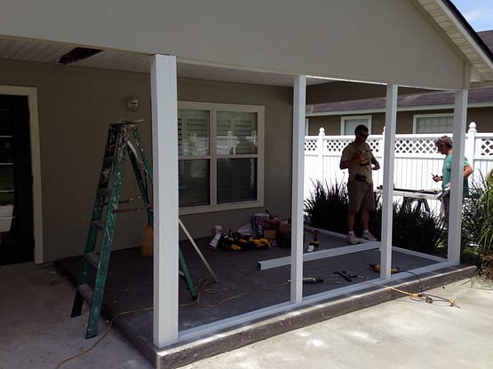 A man standing in front of a window.